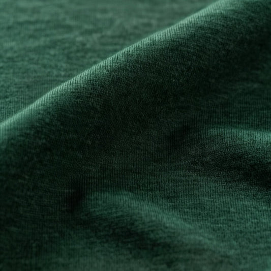 closeup of merino wool fabric. Jersey kniw, dark green
